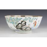 A Chinese porcelain bowl, 18th century, decorated in a famille vert palette depicting figures seated