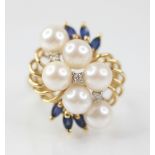 A pearl, sapphire and diamond 14ct gold cocktail ring, designed as six round cultured pearls,