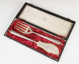 A cased Danish fish serving set by David Andersen, the tapering two-colour handles engraved with