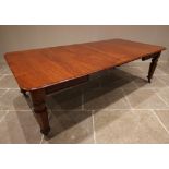 A Victorian mahogany extending dining table, the rectangular moulded top with rounded corners