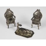 A pair of silver coloured miniature fauteuil chairs, the padded seats upon cabriole legs and