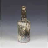 An 18th century green glass wine bottle, of mallet form with 'kick-in' base, tapering neck and