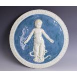 A Della Robbia terracotta circular plaque, circa 1900, relief modelled with a swaddled 'foundling'