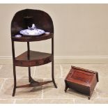 A George III mahogany corner washstand, of bowfront form, the second tier with a frieze drawer