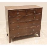 A George III mahogany chest of drawers, the rectangular top above two short and three long cock