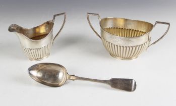 A George V silver sucrier and milk jug, John Round & Son Ltd, Sheffield 1910, each of oval form with