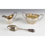 A George V silver sucrier and milk jug, John Round & Son Ltd, Sheffield 1910, each of oval form with