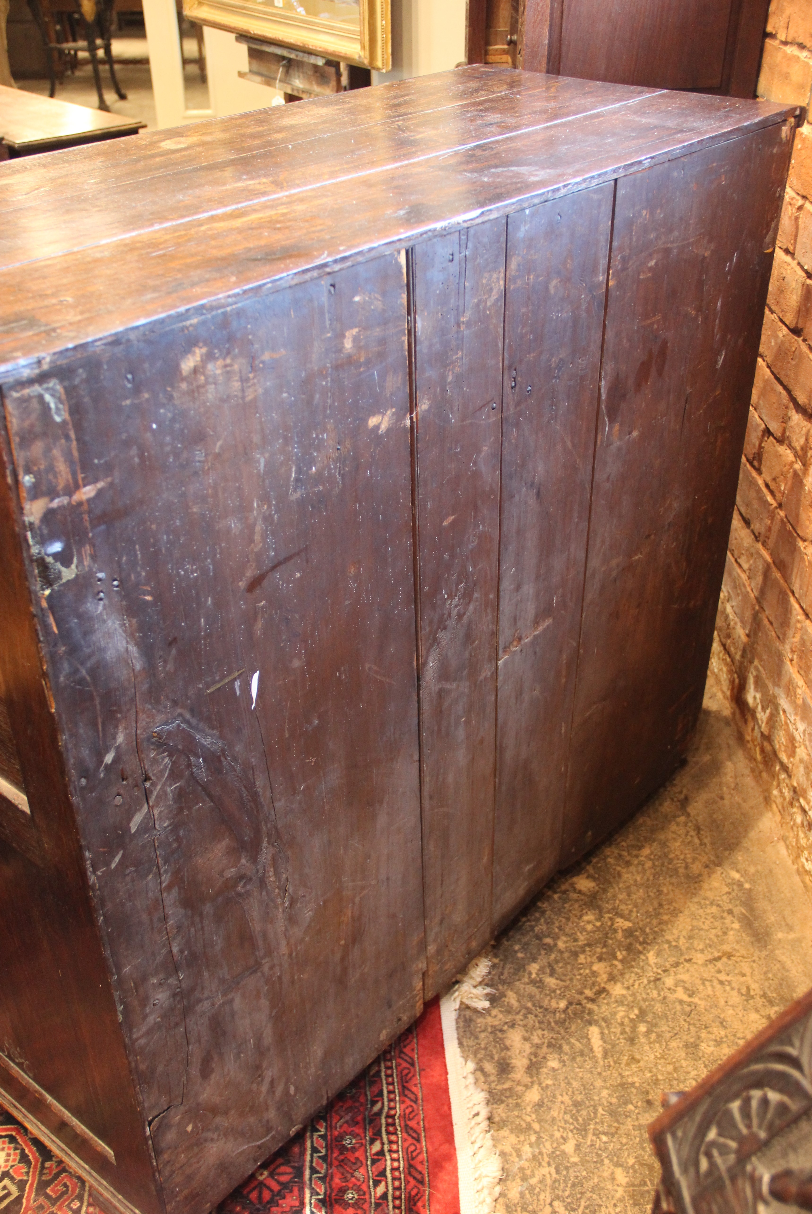 An 18th century oak chest of drawers, the moulded three plank top above two short and three long - Image 5 of 6