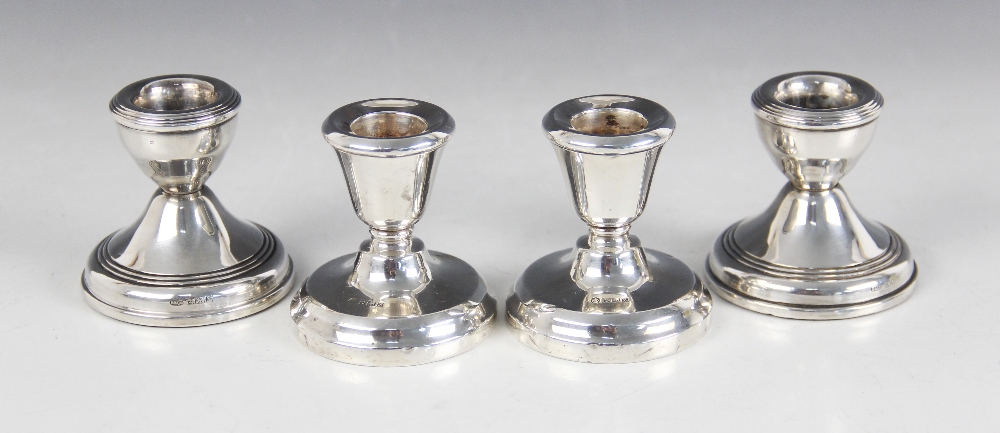 A pair of weighted silver dwarf candlesticks, W I Broadway & Co, Birmingham 1971, with tapering