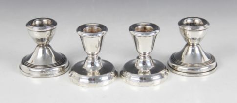 A pair of weighted silver dwarf candlesticks, W I Broadway & Co, Birmingham 1971, with tapering
