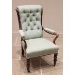 A Victorian mahogany framed open armchair, later re-covered in green fabric, the button back