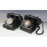 Two vintage Bakelite rotary dial telephones, one with pull-out address slide, each with modern