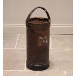 A leather covered shell carrier, late 19th/early 20th century, of typical cylindrical form, with