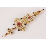 An Indian pearl, ruby and sapphire articulated brooch pin, the gold coloured mount designed as two