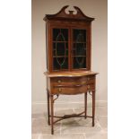 An Edwardian inlaid mahogany display cabinet on chest, in the manner of Edwards & Roberts, with a