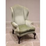 A Queen Anne style wing back armchair, mid 20th century, in green velour, the arched back