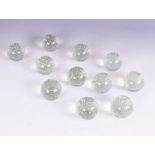 A set of eleven colourless bubble glass spheres, mid-20th century, each 6.5cm diameter (11)