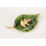 An Italian novelty brooch by Cellino, modelled as a frog with ruby set eyes, sat upon a carved