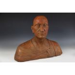 A terracotta-coloured plaster bust of a bald gentleman dressed in classical robes, 20th century,