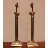 A pair of lacquered brass Corinthian column lamps, modern, each of typical fluted form upon an