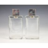 A pair of Art Deco cut glass silver mounted scent bottles, each colourless glass body of rectangular