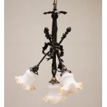 A French style four branch chandelier, early 20th century, modelled as three crossed arms "bound" to