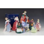 Eight Royal Doulton figurines, comprising: a limited edition HN3099 "Queens Of The Realm Queen