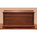 A desk top mahogany collectors/specimen cabinet, late 20th century, formed with an arrangement of