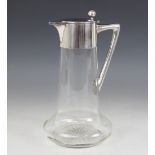 A Christopher Dresser style German silver mounted cut glass claret jug by Wilhelm Binder, of