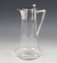A Christopher Dresser style German silver mounted cut glass claret jug by Wilhelm Binder, of