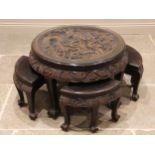 A Chinese relief carved circular occasional table with integral nest of four tables, the table top
