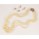 A cultured pearl necklace, comprising three rows of graduated round cultured pearls measuring