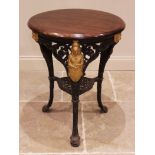 A Victorian cast iron Britannia pub table, the later circular mahogany top raised upon three cast