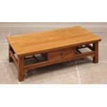 A contemporary Chinese influence golden elm coffee table, early 21st century, the rectangular slab