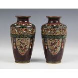 A pair of Chinese cloisonne vases, 19th century, each of tapered cylindrical from and decorated with