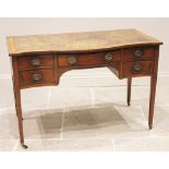 An Edwardian mahogany serpentine writing desk, in the manner of Maple & Co, the leather skiver inset