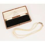A cultured pearl choker with diamond set clasp, comprising two rows of off-round cultured pearls,