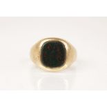 A bloodstone set 9ct gold signet ring, the central rounded square matrix measuring 10.2mm x 9.6mm,