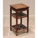 A Chinese elm bedside table, 20th century, the cleated square top above a sliding tray, raised