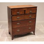 An early 19th century mahogany straight front chest of drawers, the cross banded top above two short