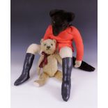 A plush toy fox dressed as a huntsman, probably by Casa Roma of Lincolnshire, modelled seated as