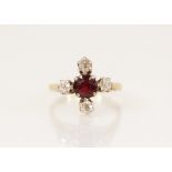 A Victorian garnet and diamond ring, the central round mixed cut garnet measuring 5.3mm diameter,