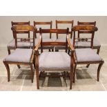 A set of five George III mahogany rail back dining chairs, the twin rail backs inlaid with a boxwood