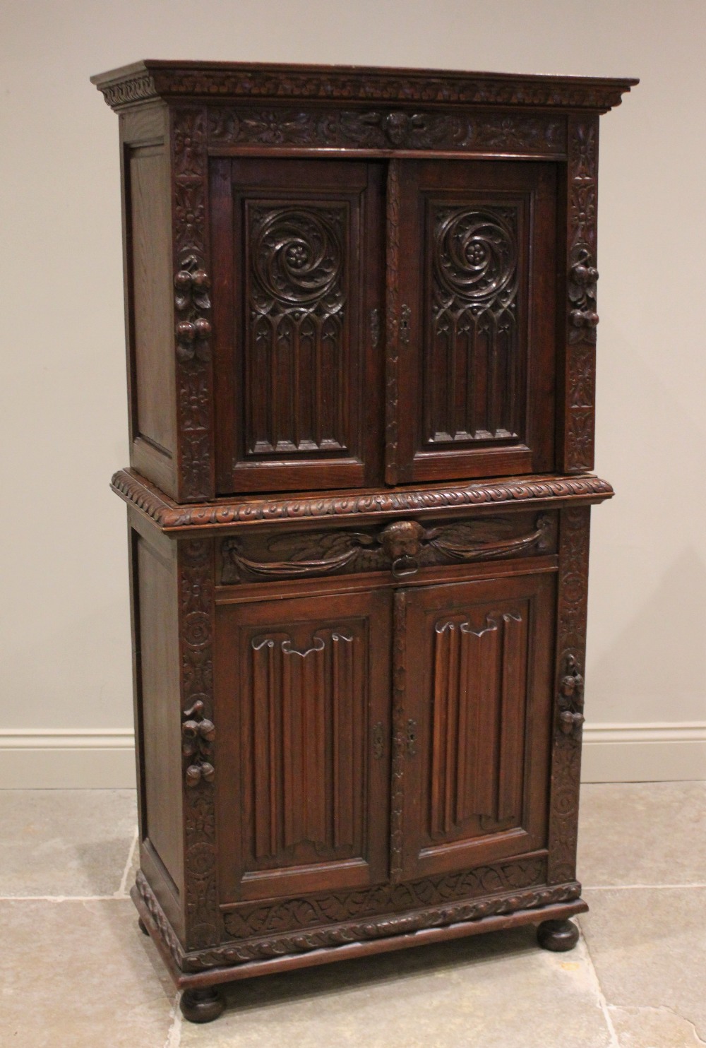 A Victorian carved oak collectors/specimen cabinet in the 17th century taste, the upper cabinet