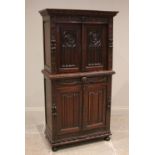 A Victorian carved oak collectors/specimen cabinet in the 17th century taste, the upper cabinet