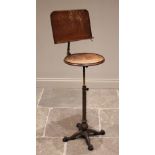 A Victorian music stand by Leveson & Sons, London, the adjustable sheet music holder above a