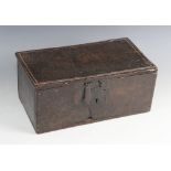 An 18th century oak candle box, the hinged top with a channelled edge and iron clasp lock, opening