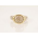 A diamond cluster ring by David Yerman, the central rounded rectangular head pave set with diamonds,