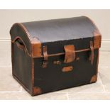 An early 20th century domed canvas motoring trunk, applied with tan leather fittings and trim,
