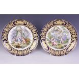 A pair of Sevres style plates, 19th century, each decorated in the manner of Jean-Antoine Watteau